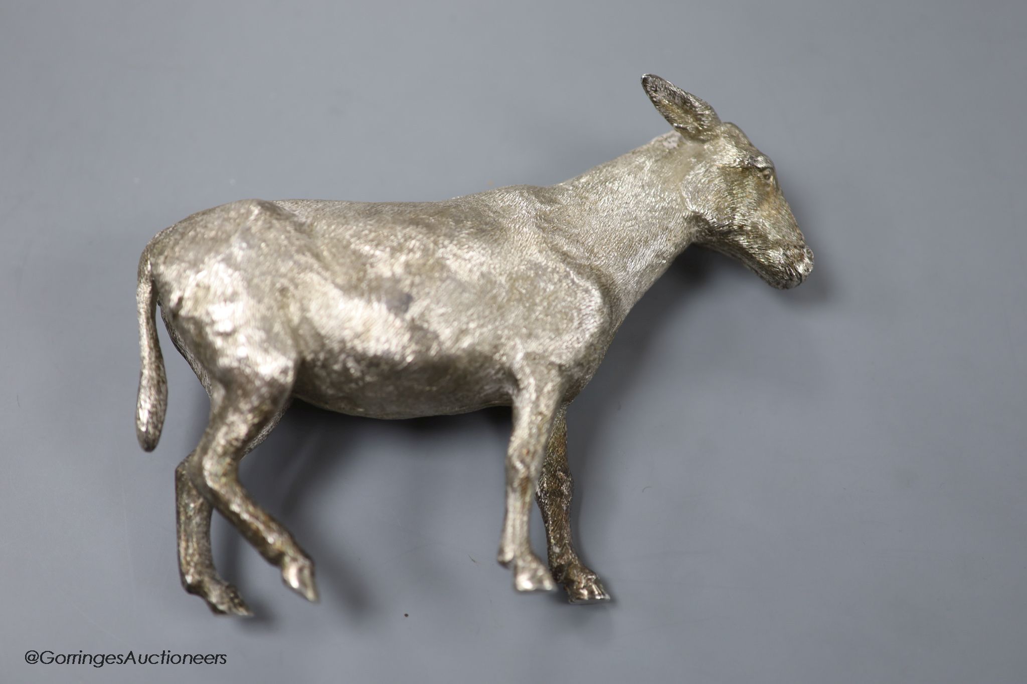 A 1960s' free standing silver miniature model of a donkey, Edward Barnard & Sons, London, 1964, height 12.5cm, 20.5oz.